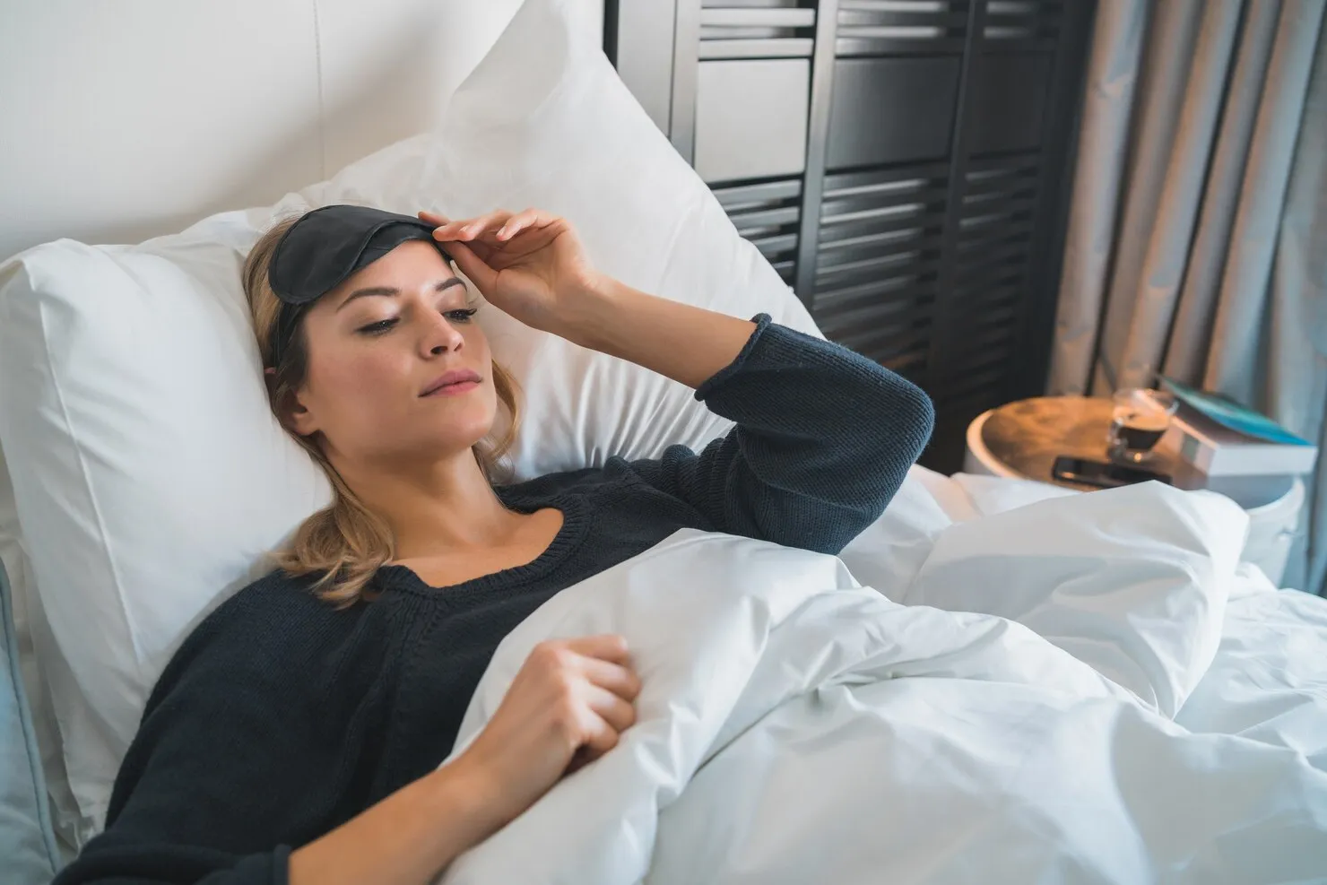 portrait-traveler-woman-relaxing-peacefully-sleeping-with-sleep-mask-hotel-room-travel-concept_58466-16097